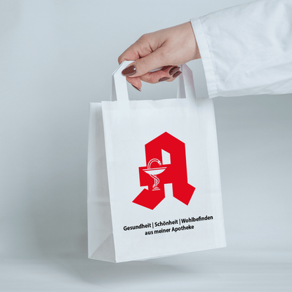 Getragene Apothekentüte. Verpackung für Ihre Apotheke